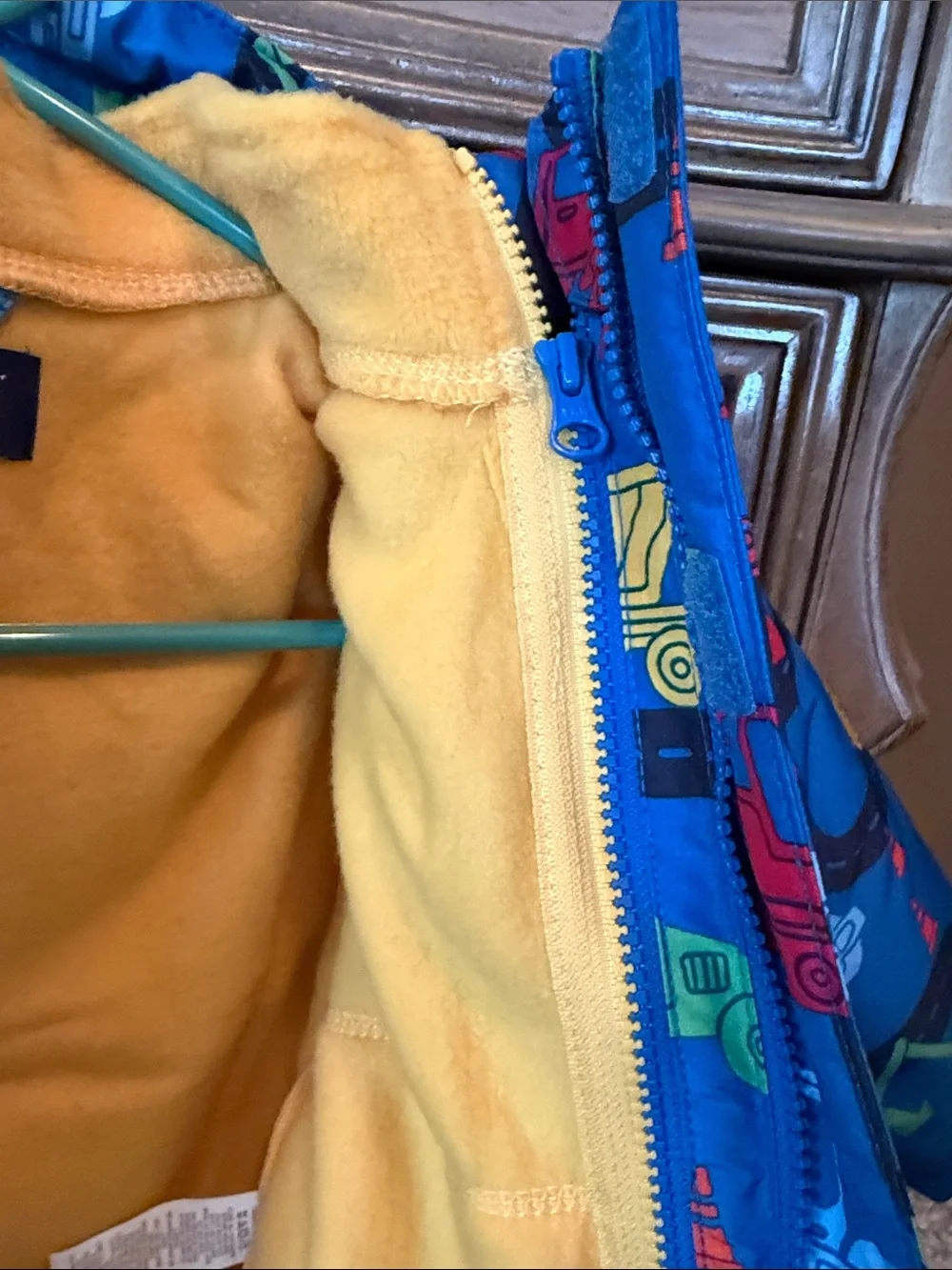 The Children's Place Blue Construction Trucks Jacket with Yellow Fleece Lining